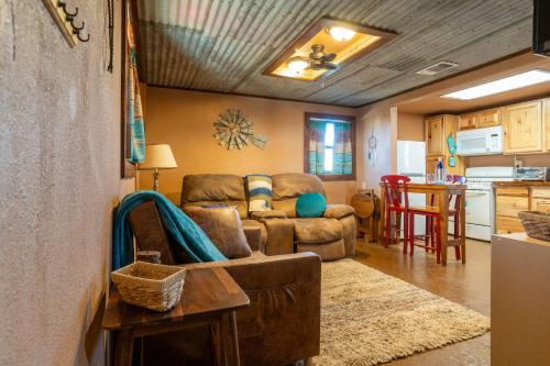 a living room with a couch and a table at The Quaint Country Home in Brownfield