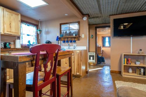 a kitchen with a counter with a bar in it at The Quaint Country Home in Brownfield