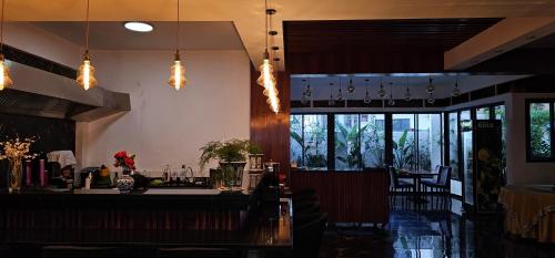 a bar in a restaurant with lights hanging from the ceiling at orientalhotel东方酒店 in Casablanca