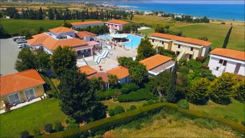 an aerial view of a house with a swimming pool at Akamanthea Holiday Village in Polis Chrysochous