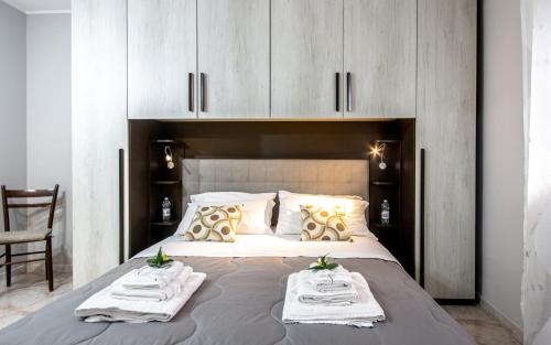 Postel nebo postele na pokoji v ubytování Etna Sunshine Apartments