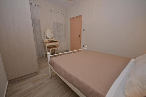 Katil atau katil-katil dalam bilik di Moutros Cozy Home