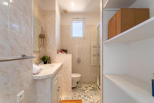 a small bathroom with a sink and a toilet at LE PROVENCAL AP4389 By Riviera Holiday Homes in Villefranche-sur-Mer