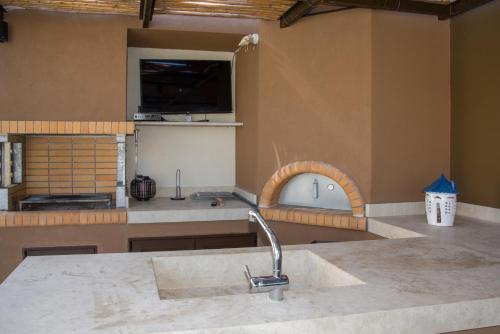 a kitchen with a sink and a counter top at Almi-Cove Hilltop Villas in Almyrida