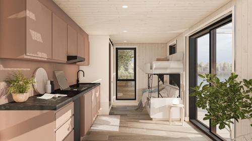 a kitchen with a large window and a sink at BoraVilla - La terra - Cantons-de-l'Est in Bury