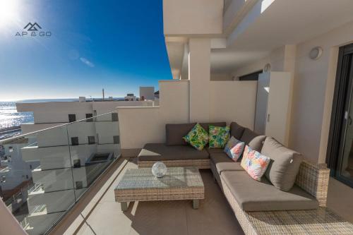 a living room with a couch and a table at Sky Marina Luxury in La Herradura