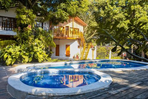 a swimming pool in front of a house at Casa Hostal Villa Del Rio in El Zaino