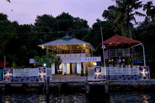 a building on the water at night at LOVESHORE Homestay in Kollam