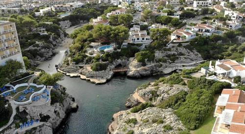 an aerial view of a river in a city at Apartamentos Islanders in Cala en Forcat