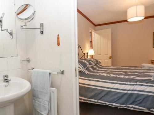 Ένα ή περισσότερα κρεβάτια σε δωμάτιο στο Teign River Retreat