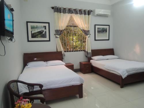 Tempat tidur dalam kamar di Sao Mai Hotel