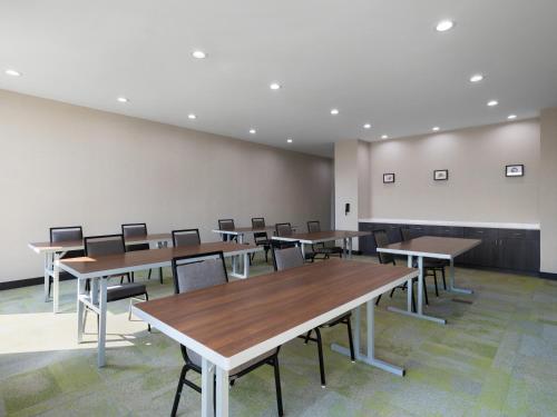 a classroom with tables and chairs in a room at Home2 Suites By Hilton Round Rock Medical Center in Round Rock