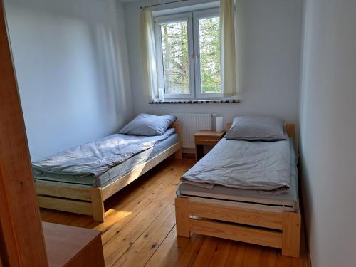A bed or beds in a room at P&P noclegi - Krosno Sikorskiego