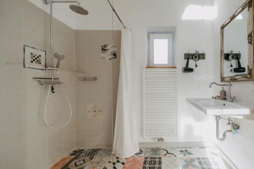 a bathroom with a shower and a sink at Claire de Lune in Stegersbach