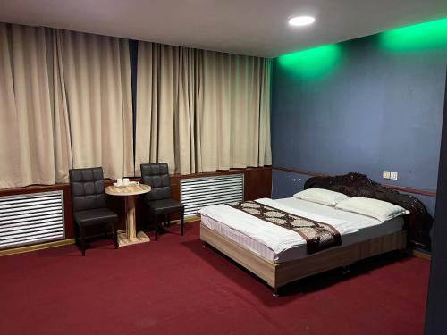 Postelja oz. postelje v sobi nastanitve Zolotoi Drakon Hotel