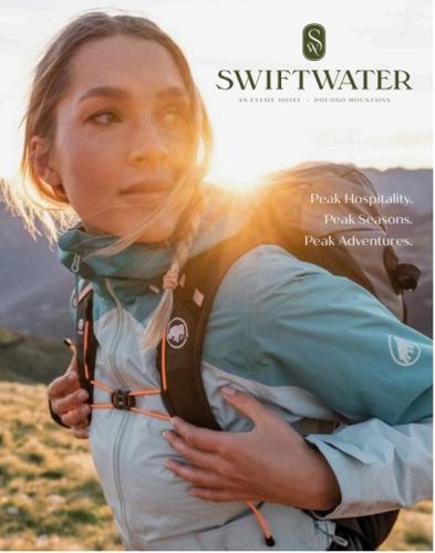 a woman with a back pack on her back at The Swiftwater in Swiftwater