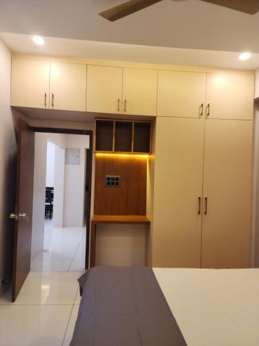 an empty room with white cabinets and a kitchen at MYKA SD ZANITA HEIGHTS in Vasco Da Gama