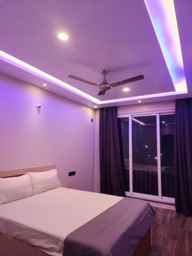 a bedroom with a bed and a ceiling fan at MYKA SD ZANITA HEIGHTS in Vasco Da Gama
