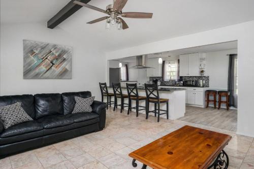 a living room with a couch and a table at Eclectic Country Home in Leander