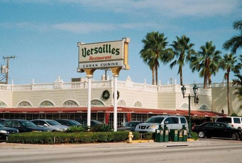 a sign in front of a car center at Prime Location Apt on Calle Ocho in Little Havana in Miami