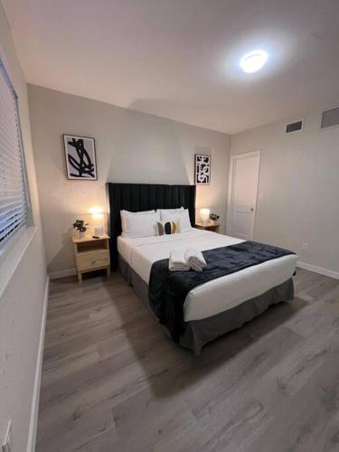 a bedroom with a large bed in a room at Prime Location Apt on Calle Ocho in Little Havana in Miami
