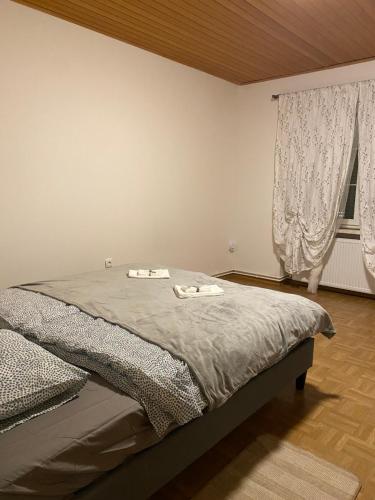 a bedroom with a bed with two towels on it at Anna in Hinterberg