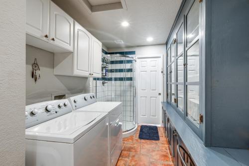 a white laundry room with a washer and dryer at Cherry Tree Studio Arizona Retreat Near Route 66 in Williams