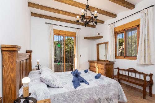 a bedroom with a bed with blue teddy bears on it at Villa Bonifacio in Maro