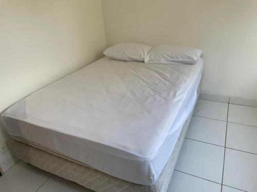 Ein Bett oder Betten in einem Zimmer der Unterkunft Acomodação Montreal