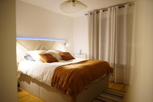 Postel nebo postele na pokoji v ubytování Lilou Home - Appartement proche Disneyland Paris