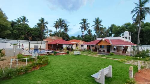 a view of a house with a yard at Athulya Resort -Leisure and Luxury cottages from EMBEHolidays in Kottaikadu