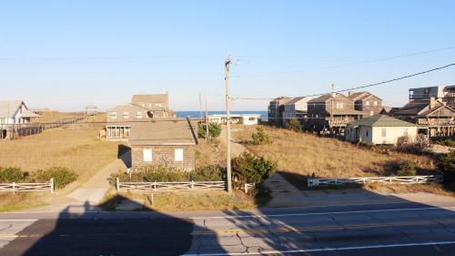 a view of a street with houses and a train at Semi-Oceanfront, Close to Beach Access, KD240, The Ocean Winds in Kill Devil Hills
