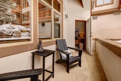 a porch with two chairs and a window at Powderhorn Lodge 102: Sego Lily Suite in Solitude