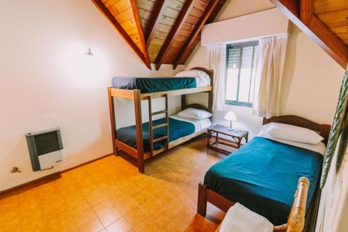 En eller flere senge i et værelse på Hotel Apartur Mar del Plata