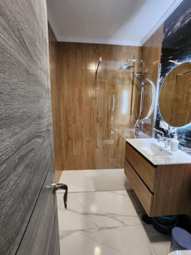 a bathroom with a shower and a sink at Boomerang in Benidorm