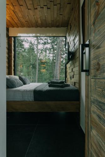 Postel nebo postele na pokoji v ubytování Tara Cabins Pure Nature