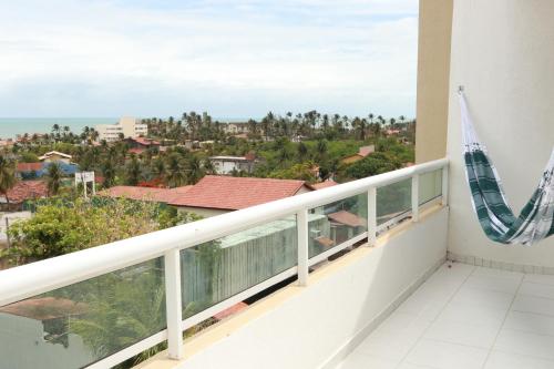 a balcony with a view of the city at Apartamentos Cumbuco Condomínio Vila Real in Caucaia