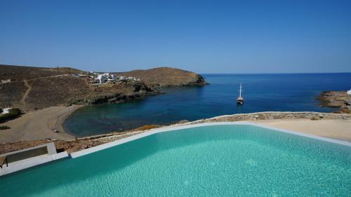a swimming pool with a view of the ocean at Sea Rock & Sky Private Mykonos Residence in Merchia Beach