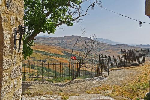 a gate on a hill with a view of a valley at Casa Vacanze La Dimora di Santa Barbara in Petralia Soprana