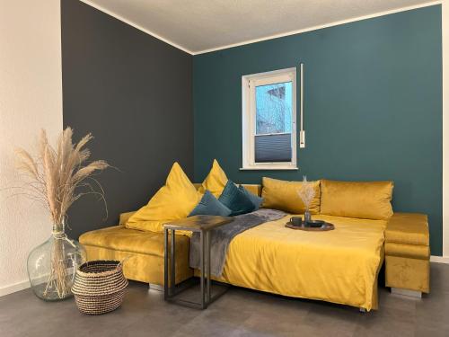 a bedroom with a bed and a couch at WOHNTRAUM in Altendiez in Altendiez