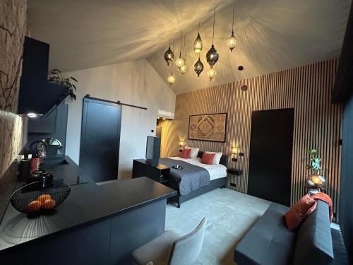 a bedroom with a bed and a table and chairs at te gast ByBreg in Apeldoorn