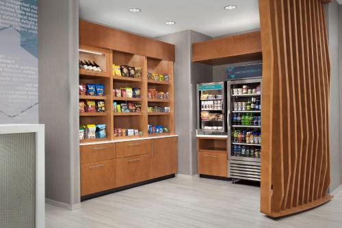 a room with wooden shelves and a grocery store at SpringHill Suites by Marriott Fayetteville I-95 in Fayetteville