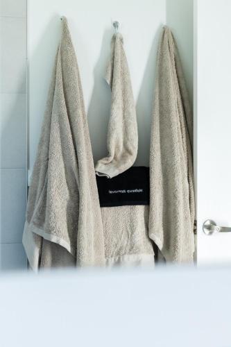 a towel hanging on a rack in a bathroom at 40 On North. in Wondoan