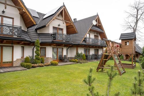 Vonkajšia záhrada v ubytovaní Lux-Apart Zakopane
