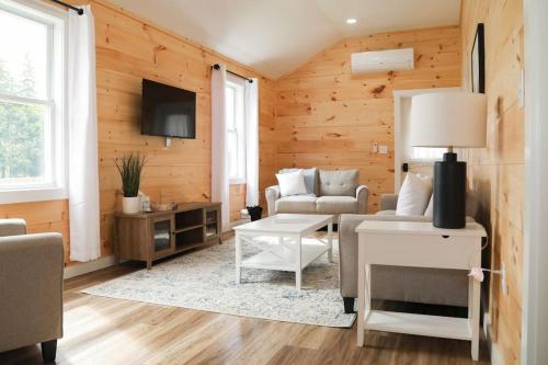 a living room with a couch and a table at Hartman Center Campground in Milroy