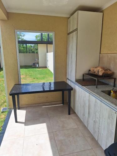 a table sitting inside of a room with a window at Alberdi 1218 in Colón