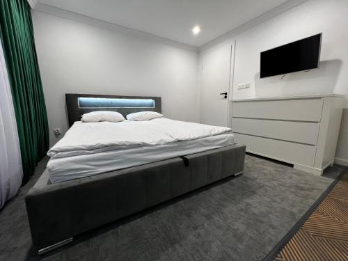 Posteľ alebo postele v izbe v ubytovaní Kościelna Apartament SPA