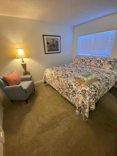 a bedroom with a bed and a chair at Miami U Gallery Superior King Private Bedroom in Shared Apartment in Oxford
