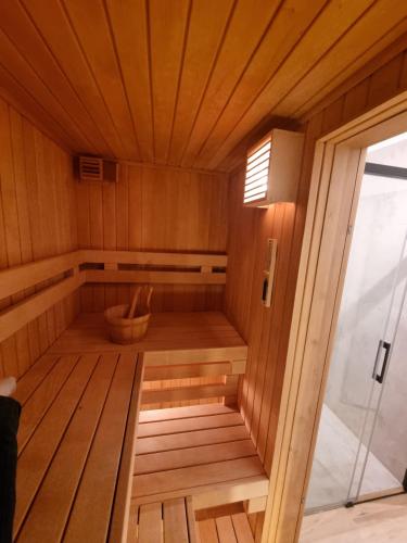 an inside of a sauna with a window at SZUMI ROSA in Majdan