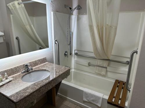 a bathroom with a sink and a shower at Quality Inn in Ashland